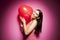 Beautiful cheerful woman with valentines day balloon