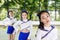 Beautiful cheerleader team performing in the field