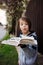 Beautiful child, boy, holding book, reading, playing, creative knowledge shot with book