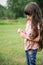 Beautiful child girl with long hair outdoors