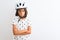 Beautiful child girl wearing security bike helmet standing over isolated white background skeptic and nervous, disapproving