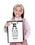 Beautiful child holding a vision exam chart