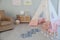 Beautiful child`s room with blue hopscotch floor sticker