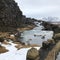 Beautiful chilling view of a river by a rocky mountainside - perfect for wallpaper