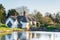 Beautiful chocolate-box thatched cottage and pond in the Shropshire village of Badger in the UK