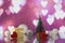 Beautiful Christmas composition with Christmas tree, Hearts, gift or present box and decorative snowballs against holiday lights b