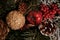 Beautiful Christmas decorations: a cone with snow, a red apple, a golden cone and a golden ball, a red curler,