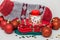 Beautiful Christmas decorations, red candle, knitted socks, balls, wooden carved toys and bells