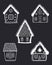 Beautiful Christmas houses. Set of winter houses. White silhouettes of fabulous buildings on a dark blue background
