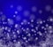 Beautiful Christmas image . White snow flakes on a blue background. abstract