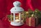 Beautiful christmas and new year holidays still life. White retro lantern with burning candle and christmas decorations