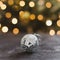 Beautiful christmas silver ball on dark black background. Copy Space. trendy holiday concept. Christmas Decoration.