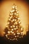 Beautiful christmas tree golden lights hearts in festive room. c