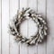 Beautiful Christmas wreath of fresh spruce on white wooden background. Christmas mood