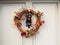 Beautiful christmas wreath on front of door hanging close up