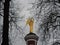 Beautiful Church near the water in the estate Grebnevo in the Moscow region. The figure of the Archangel holding the cross on the