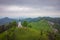 Beautiful church of Saint Jakob or Jacob on the top of a hill in Slovenia, a beautiful landmark in the middle of the green terrain