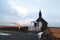 beautiful church and white gates at cloudy day in Budir, Snaefellsnes