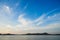 Beautiful cirrus clouds on blue sky over the sea