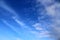 Beautiful cirrus clouds in natural cloud formations in a deep blue sky