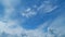 Beautiful cirrus and cumulus cloud formations in a deep blue sky. Soft cirrus couds on blue sky. Timelapse.