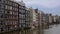 The beautiful city of Amsterdam, ancient architecture, river canals and boats. Holland