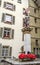 Beautiful City Street View of the colorful medieval Banneret statue on top of elaborate fountain in Bern, Switzerland.