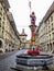 Beautiful City Street View of the colorful medieval Zahringen statue on top of elaborate fountain in Bern, Switzerland.
