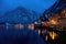 beautiful cityscape of the special city Hallstatt in Austria Salzkammergut snowy winter mountains and lake after sunset