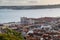 Beautiful cityscape view over Lisbon, Portugal, including orange rooftops, river Douro and Rua Augusta Arch