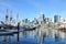 Beautiful cityscapes and boats with its shadows on water at Darling Harbour.