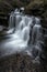 Beautiful claming landscape image of Scaleber Force waterfall in Yorkshire Dales in England during Winter morning