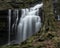 Beautiful claming landscape image of Scaleber Force waterfall in Yorkshire Dales in England during Winter morning