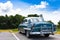 A beautiful classic car in cuba under blue sky