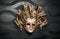 Beautiful classical mask from Venice on black wall. Carnival mask