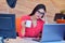 Beautiful classy brown haired businesswoman enjoying coffee in bright office