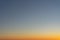 Beautiful clear, morning sky at sunrise, natural background. Soft gradient from orange to blue