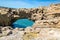 Beautiful cliffs on atlantic coastline with turquoise ocean wave erosion caves background in vivid colors in biarritz, basque cou