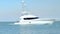 Beautiful clip of white yacht boat sailing slowly on the blue water on a sunny day