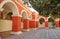 Beautiful Cloister with Orange Red Columns and Wall Fresco Paintings in the Monastery of Santa Catalina, Peru