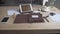 Beautiful close up view on business work area desktop with tablet cell phone coffee mug watch leather note book