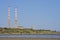Beautiful closeup bright view of iconic Poolbeg power station chimneys and Poolbeg CCGT station against clear blue sky