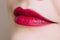 Beautiful closeup female plump lips with bright color makeup