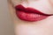 Beautiful closeup female plump lips with bright color makeup