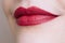 Beautiful closeup female plump lips with bright color makeup
