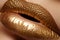 Beautiful closeup with female plump lips with gold color makeup. Fashion celebrate make-up, glitter cosmetic