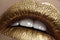 Beautiful closeup with female plump lips with gold color makeup. Fashion celebrate make-up, glitter cosmetic. Christmas style