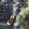 Beautiful closeup shot of a guitar placed next to a wall