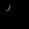 Beautiful closeup view of a crescent moon and a star during the night
