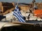 Beautiful closeup of the white and blue Greece flag on the top of the boat